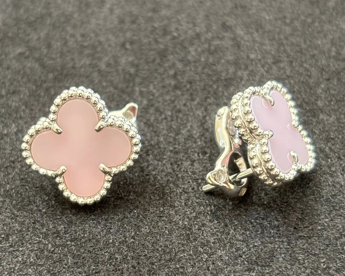 White gold earrings set with natural certified stones