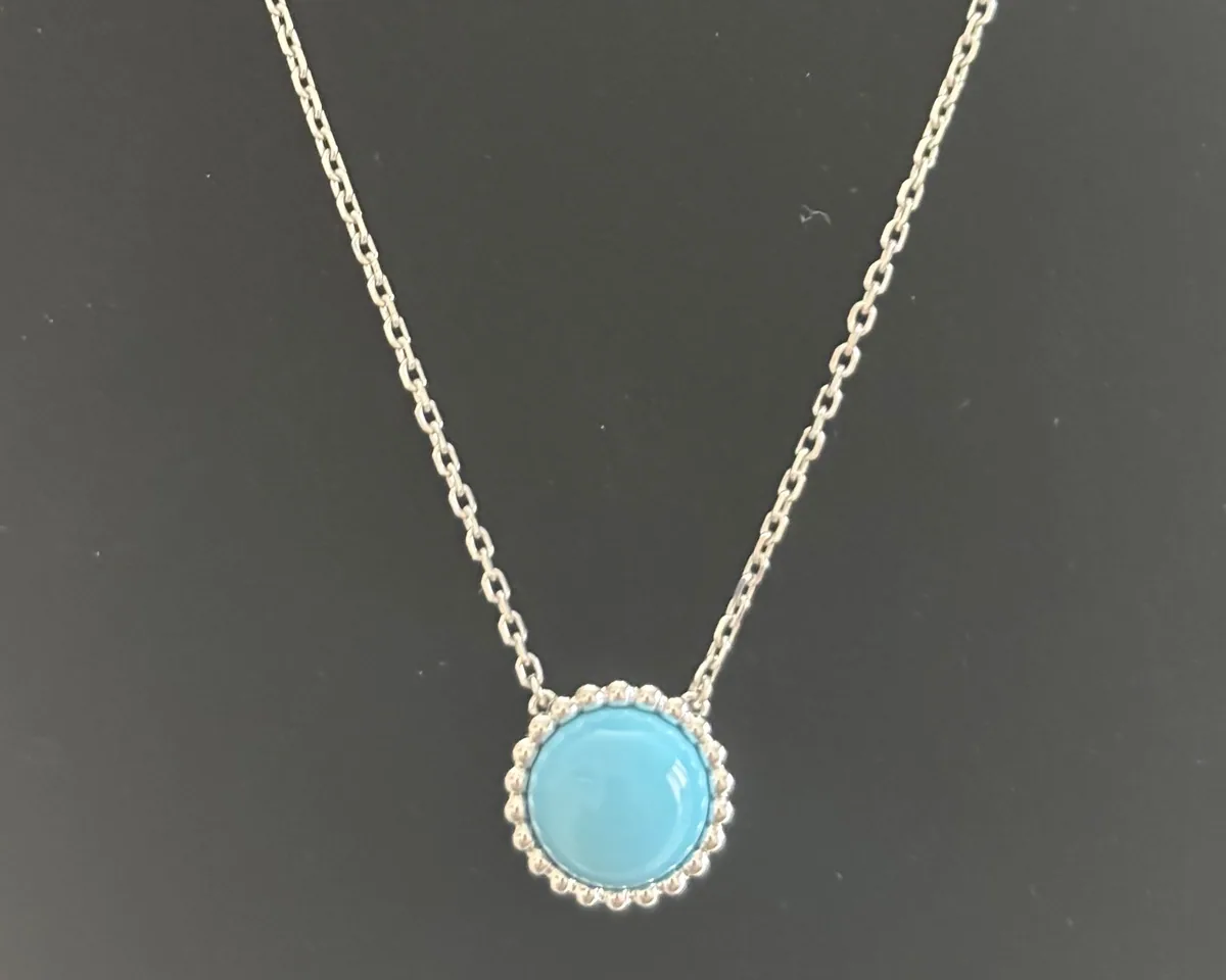 White gold necklace set with natural certified stones